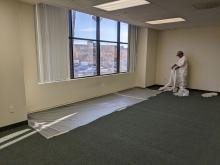 Painter masking off the carpet